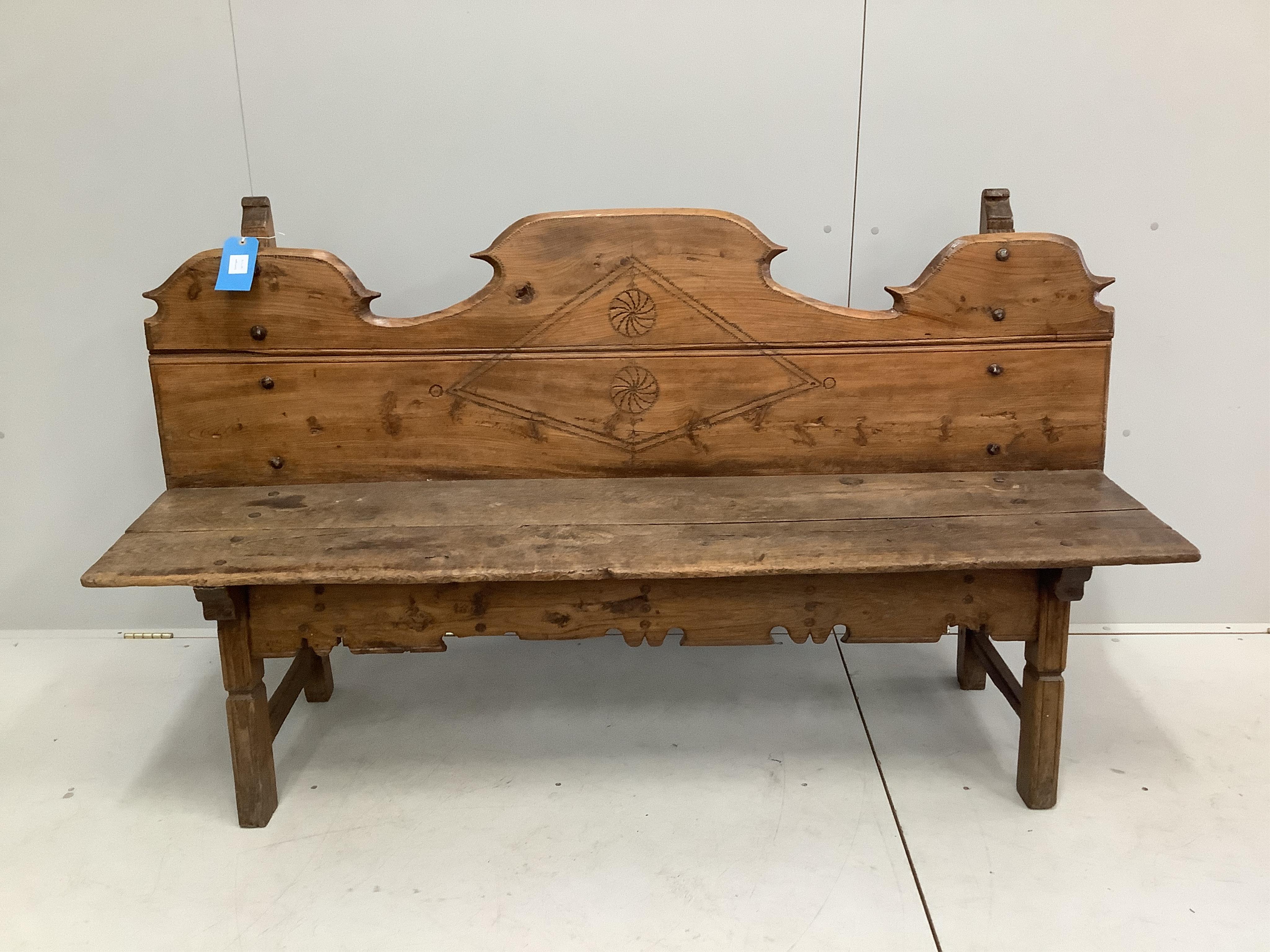 An 18th / early 19th century Provincial Spanish pine bench, width 174cm, depth 42cm, height 97cm. Condition - fair